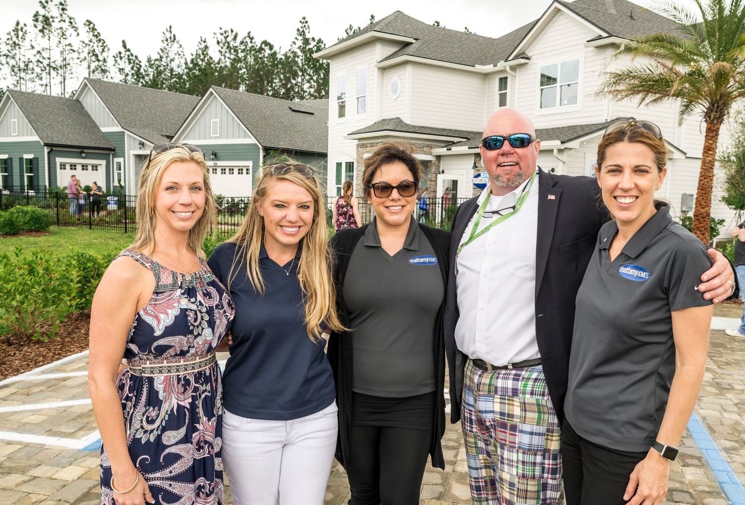 Mattamy Homes and Dream Finders Homes team members gather at the Beacon Lake grand opening event on April 21.